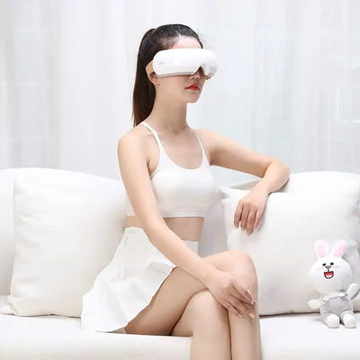 Customized Lable Black Eye Relax Massager with Heating Hot Compress and Vibration Electric Massage